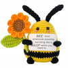 Handmade crochet bee animal doll with a flower and a card that says bee kind whenever possible but sting like a wasp when you