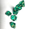 A set of seven translucent green acrylic polyhedral dice arranged diagonally on a white surface.
