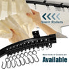 A hand is installing a black curtain track system with silent rollers onto a white curtain.