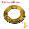 A coil of 3 meters of gold-colored flexible car interior trim strips with a tool.