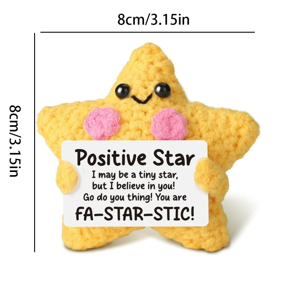 Handmade yellow crochet star animal doll with pink accents and a positive message card