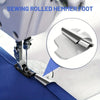 Close-up view of a sewing machine foot with a rolled hemmer foot attached to the needle plate.