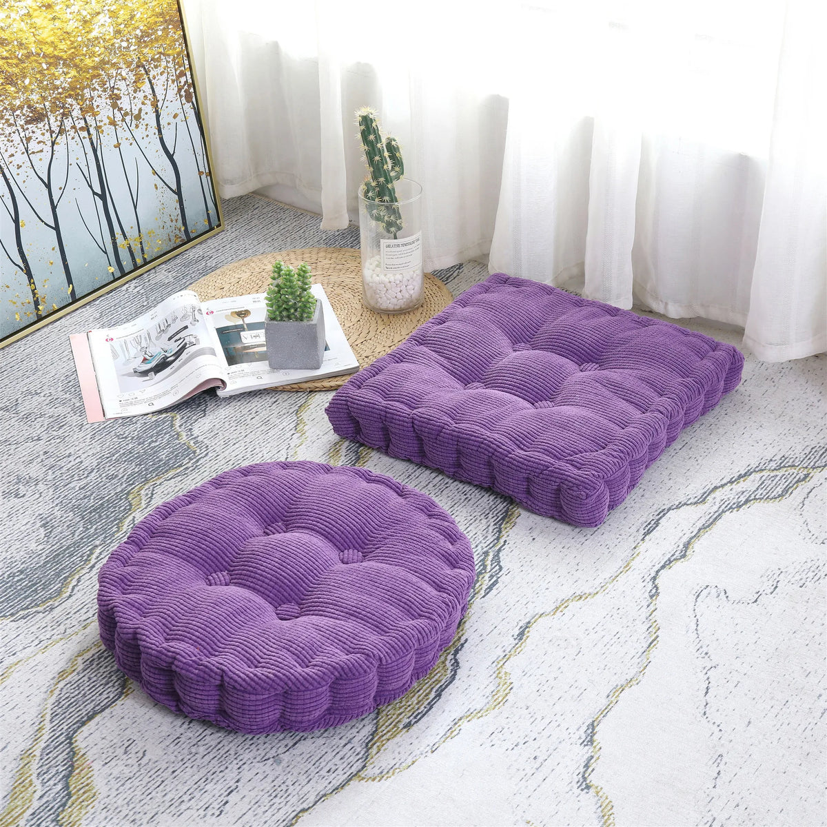 A purple thick corduroy floor cushion is placed on a light gray rug in a bright room.