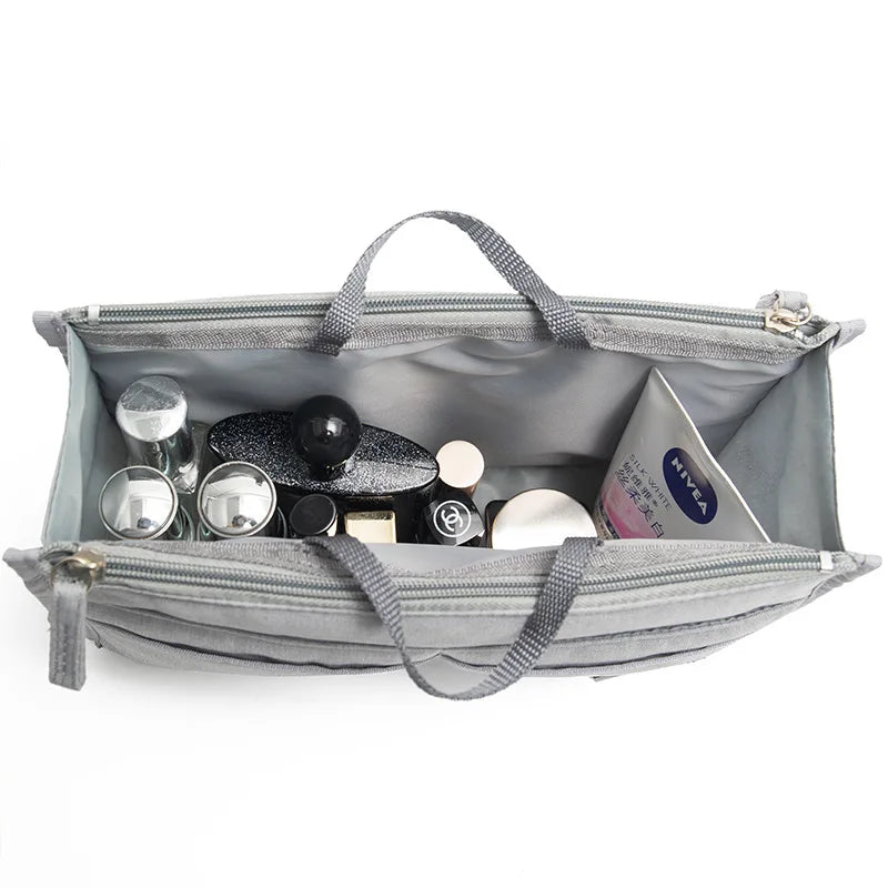 Gray purse organizer insert with multiple compartments and dividers for small items