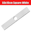 White square diatomite faucet mat with raised concentric lines and a central hole