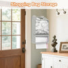 Wall-mounted storage dispenser for shopping bags with clear compartments in a kitchen or pantry setting