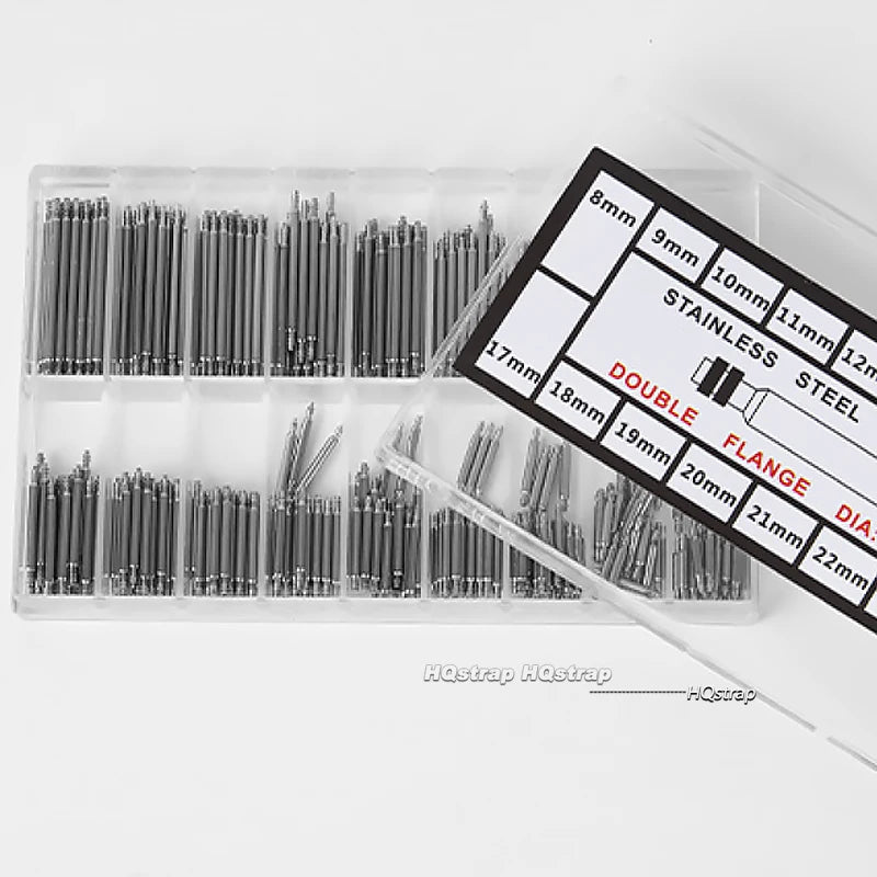 A plastic kit containing various sizes of stainless steel watch spring bars for mounting.