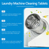 A close-up of laundry machine cleaning tablets next to a white washing machine drum.