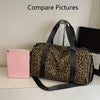 A leopard print weekender tote bag with a black strap and shoe compartment resting next to a pink tablet.