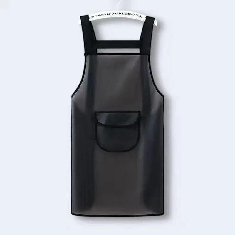 A black waterproof kitchen apron hanging against a light gray background.