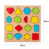 A wooden puzzle board featuring various colored and shaped pieces for toddlers.