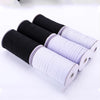 Rolls of black and white polyester elastic bands for sewing and crafts