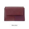 A deep wine red RFID-blocking tri-fold wallet with a textured leather finish.