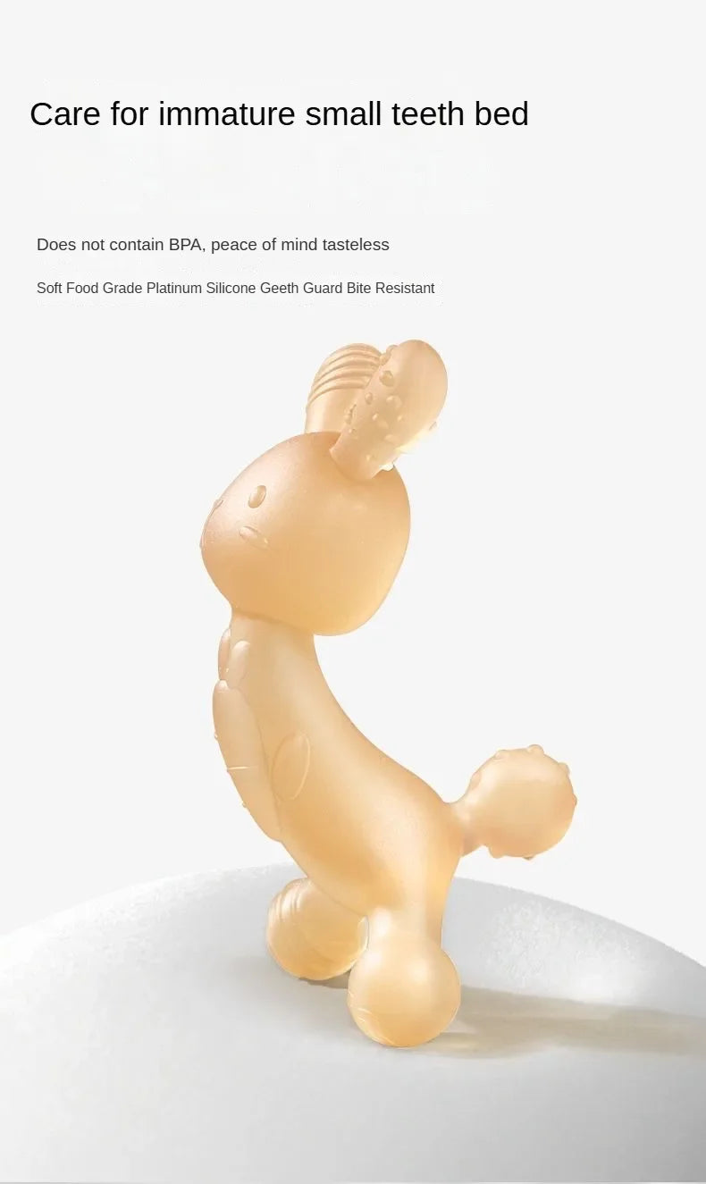 A soft, light beige silicone cartoon rabbit teether for babies resting on a white surface.