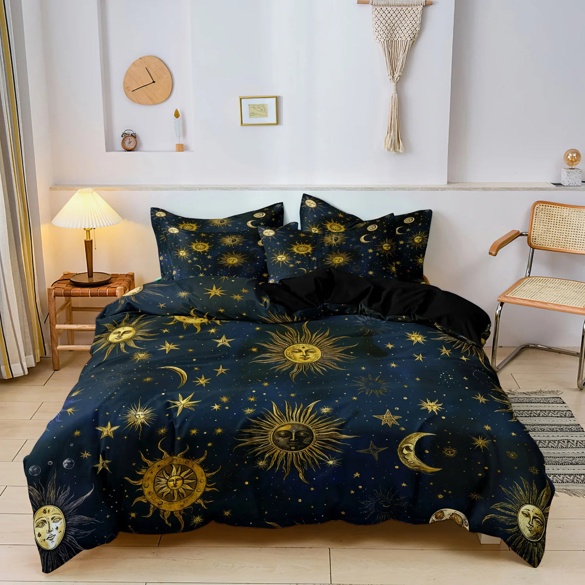 A dark blue duvet cover set featuring a celestial design of suns, moons, and stars.