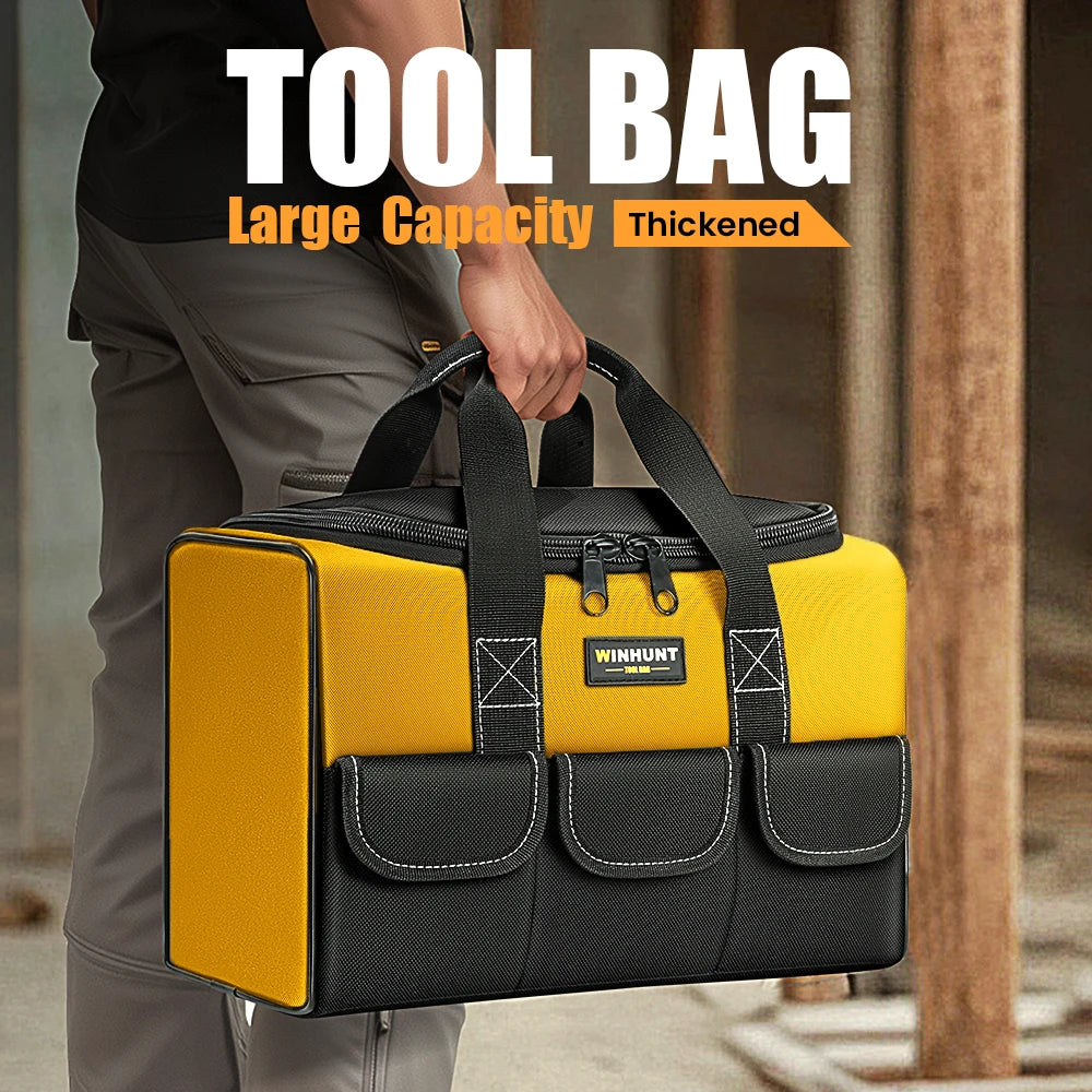 A person holds a yellow and black tool bag with six exterior pockets in a vertical view.