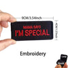 Black embroidered patch with red text saying Mama Says I'm Special