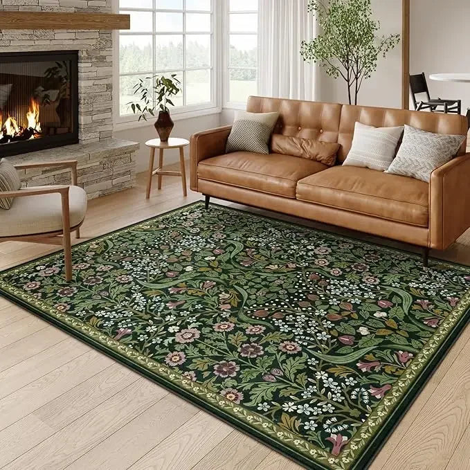 A vintage floral soft area rug featuring green and pink botanical patterns in a living room setting.