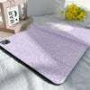 A purple composition notebook iPad case with a pencil holder is shown on a white sheet.