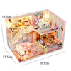 A miniature 3D wooden dollhouse building kit featuring furniture and interior decor.