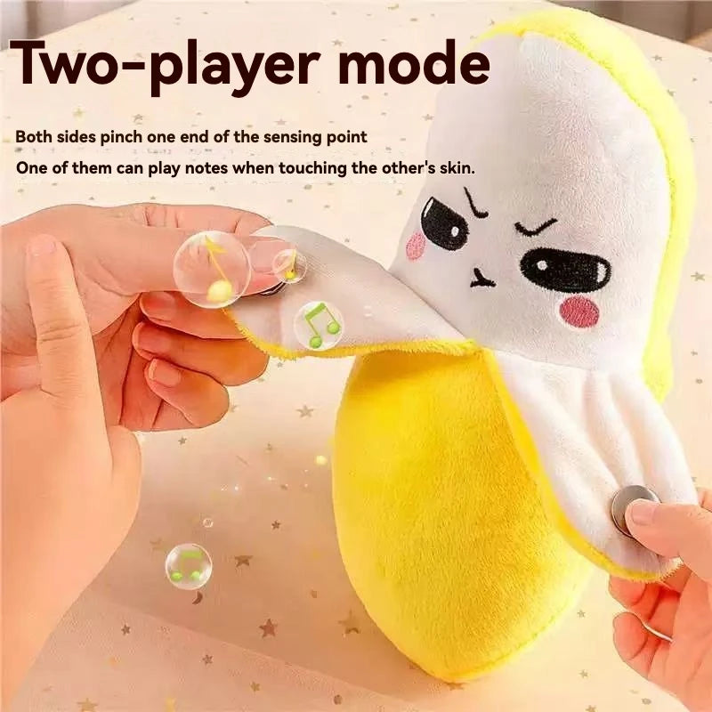 Two-player mode plush toy where two sides pinch a sensing point to play notes when touching the skin