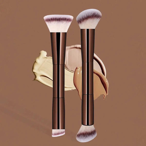 Un paire de pinceaux de maquillage professionnels à double tête, avec des poils roses et des accents dorés.