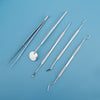 A set of premium stainless steel dental care tools for oral hygiene, including various instruments.