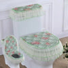 A set of antibacterial toilet seat covers with washable cushions in green and pink floral patterns.