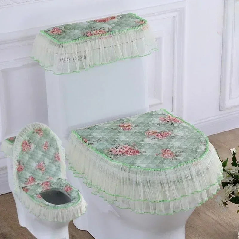 A set of antibacterial toilet seat covers with washable cushions in green and pink floral patterns.