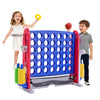 A boy and a girl play with a red and blue outdoor game set featuring a basketball hoop and ring toss.