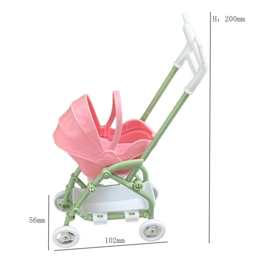 A pink fashion doll accessories set featuring a white and green pram or stroller with a handle.
