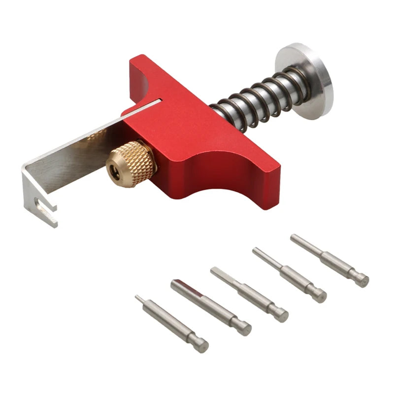 A red tool for removing tiny whoop propellers, featuring a metal lever and an ejector pin kit.