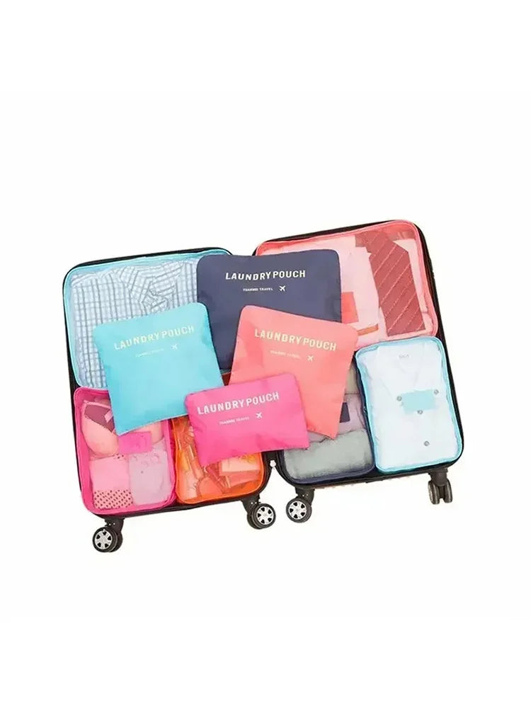 A set of six colorful laundry pouches or packing cubes displayed on a black stand.
