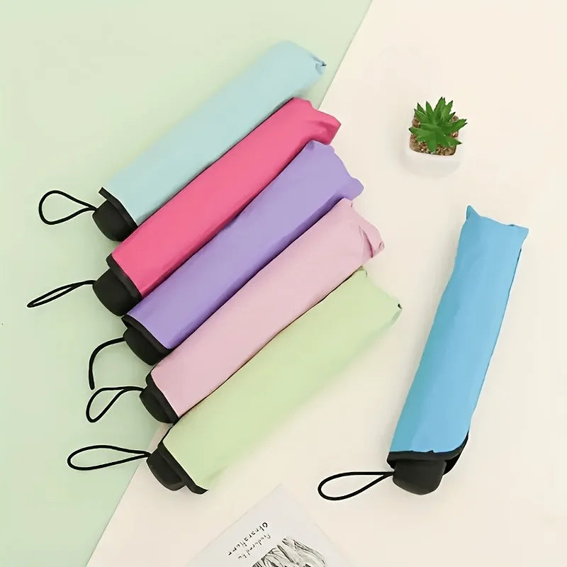 A collection of floral bloom rain and sun umbrellas in various pastel colors, including pink, purple, mint green, and light b