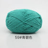 A ball of teal colored 4-ply milk cotton yarn for knitting and crochet.