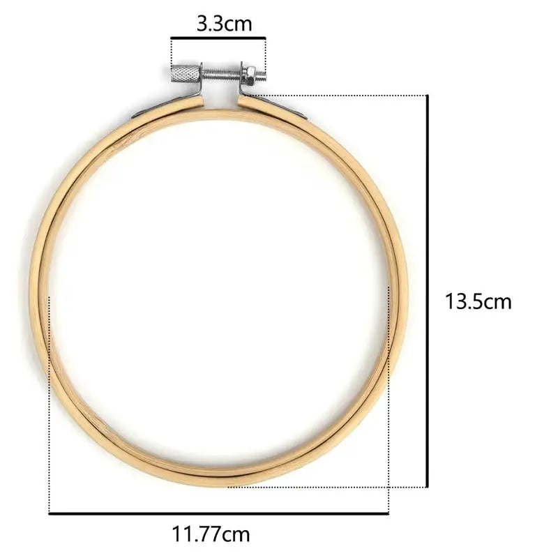 A gold-colored bamboo embroidery hoop with an adjustable screw, measuring 13.5cm in diameter.