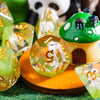 A set of adorable animal resin dice, including a house and a panda, resting on a wooden surface.