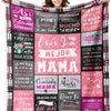 A colorful printed fleece throw blanket featuring text in Spanish and English about mothers