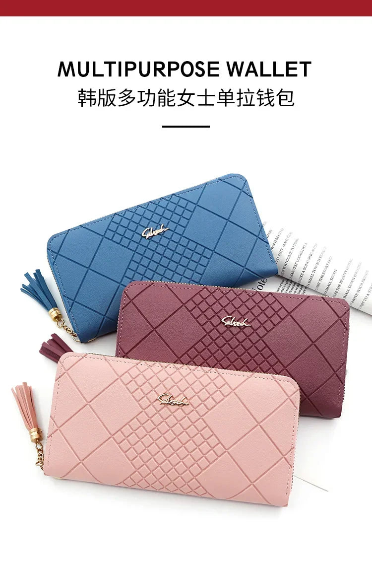 Three multipurpose wallet clutches in blue, pink, and mauve colors displayed on a white background.