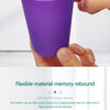A hand holds a purple flexible cup demonstrating its memory rebound feature.