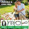 A man and woman are using a flexible garden hose for watering plants in a garden setting.