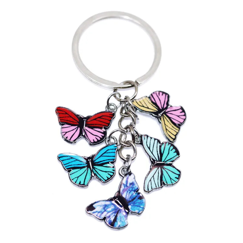 Silver keychain charm featuring colorful butterfly charms