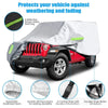 A white and gray outdoor car cover protecting a Jeep Wrangler against weathering and fading.
