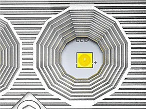 A close-up view of an LED flood light pod, showing the light element and surrounding textured housing.