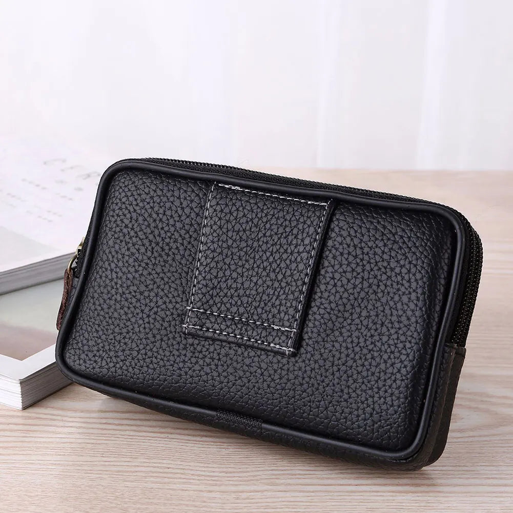 A black men's multi-function PU leather waist bag with a stitched pocket shown on a wooden surface.