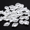 A pile of 100 clear acrylic pearl spacer beads for jewelry making