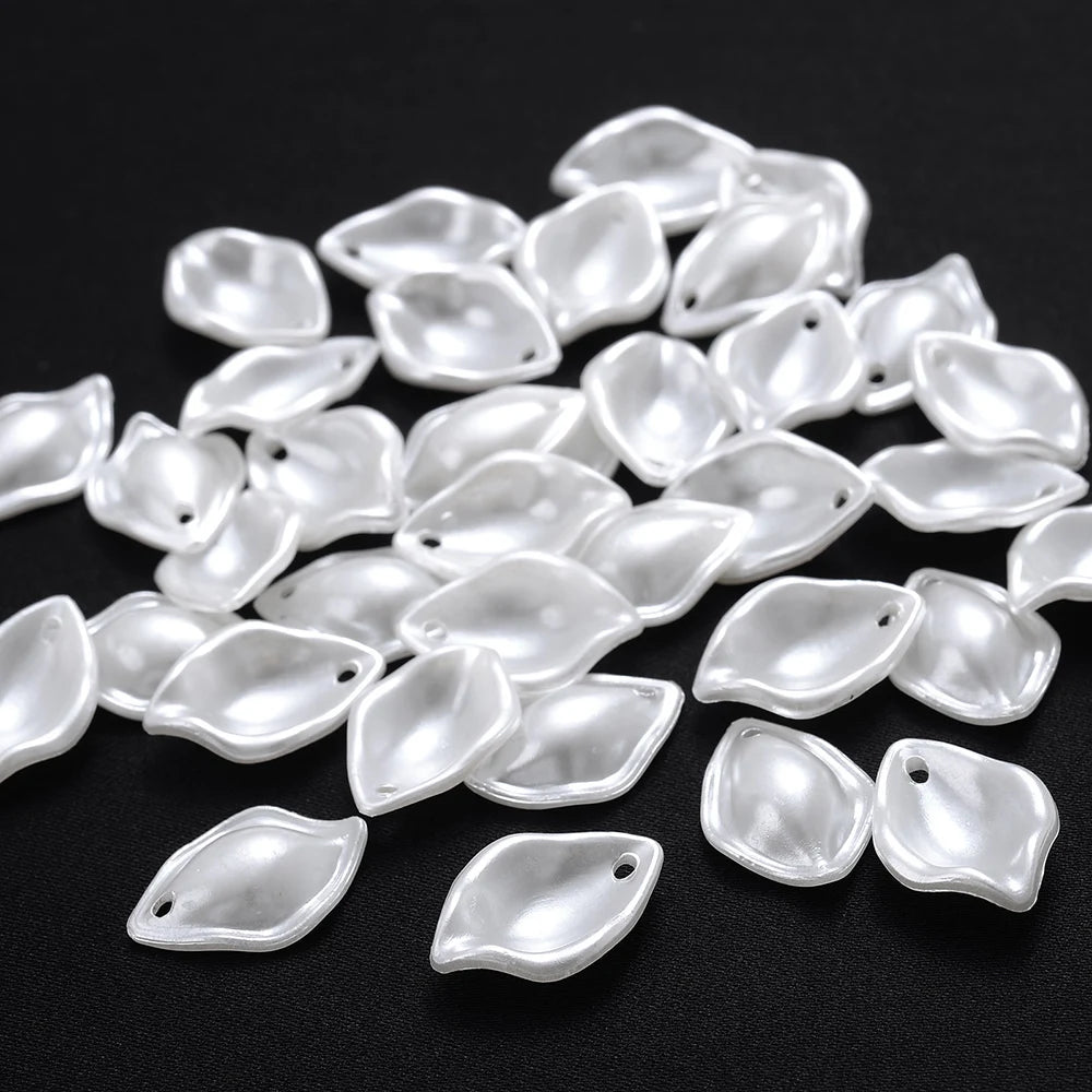 A pile of 100 clear acrylic pearl spacer beads for jewelry making