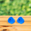 Two bright blue reusable silicone water jug caps resting on a light wooden surface.