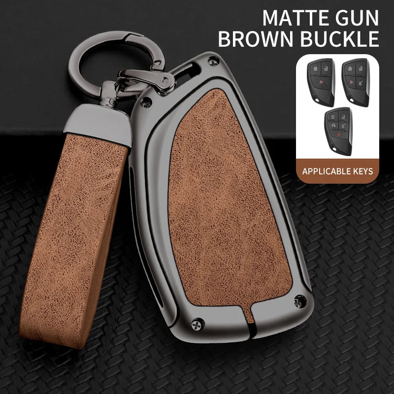 A matte gun brown buckle key case with a leather strap and multiple keys displayed on a black background.