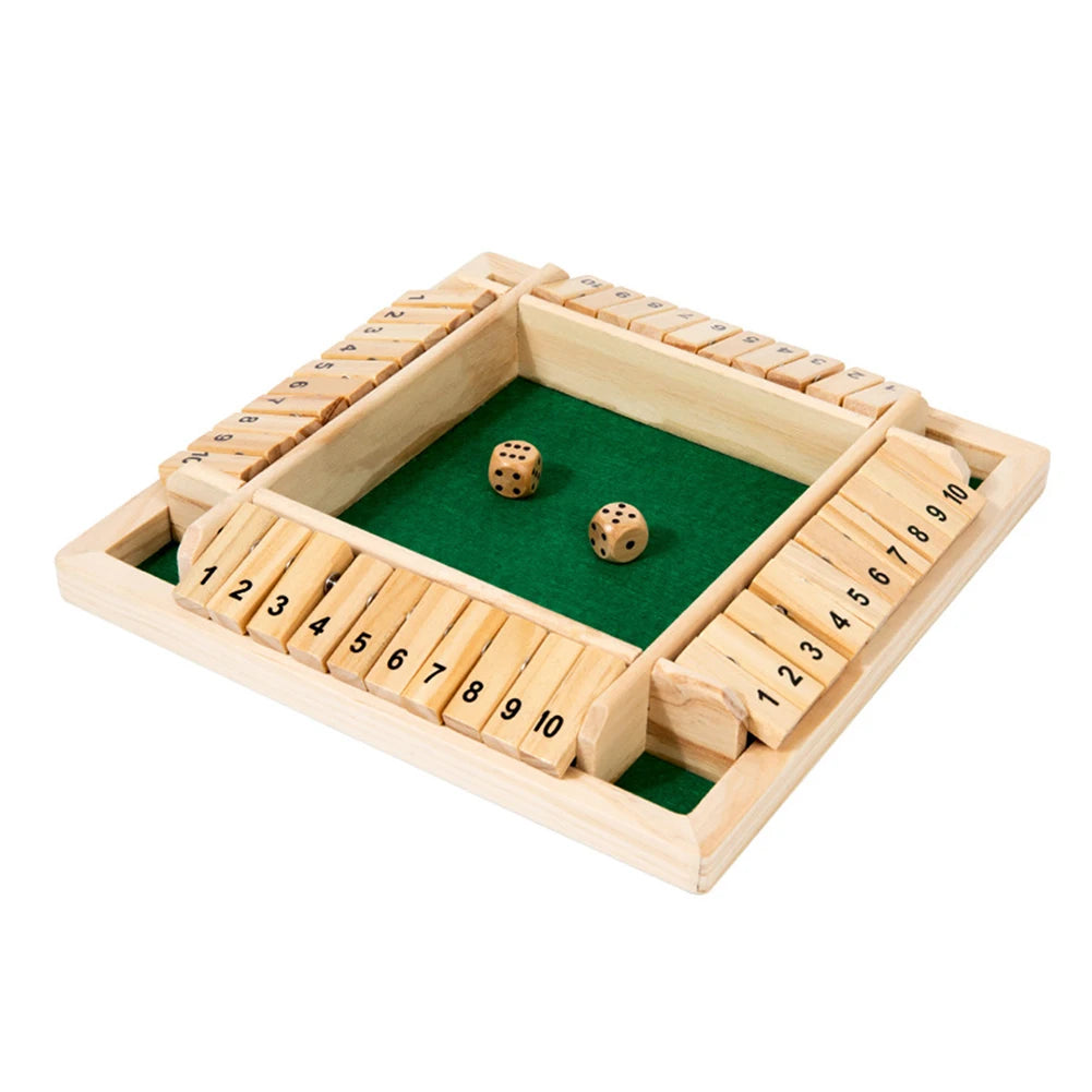 A wooden shut the box dice game with a green board and wooden dice blocks.